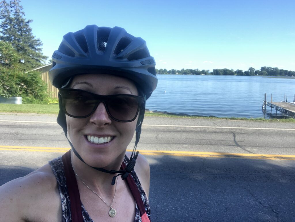 Aimee smiling with a bike helmet on