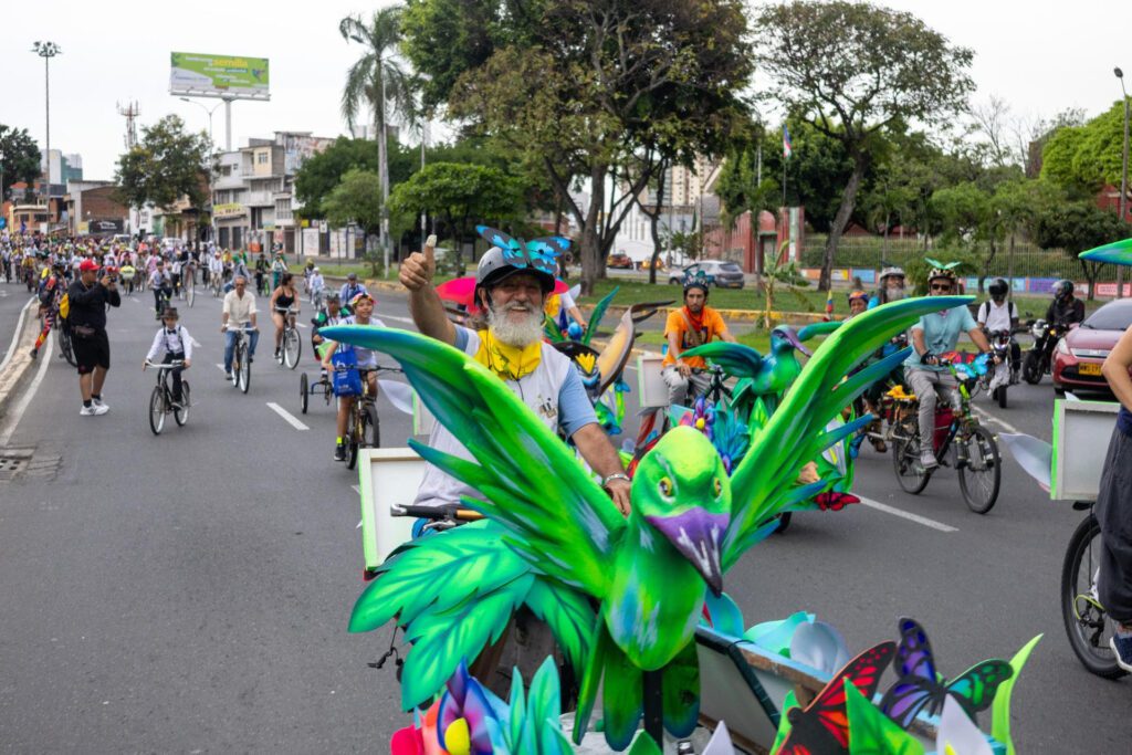 Bicycle activists cycle to COP in a fun peaceful protest organised by Movilizatorio. People are in fancy dress and have decorated their bikes with art installations to look like birds and colourful animals
