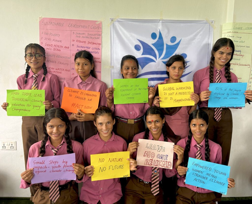 Students of the Women Welfare Foundations, stood with signs that advocate for the climate