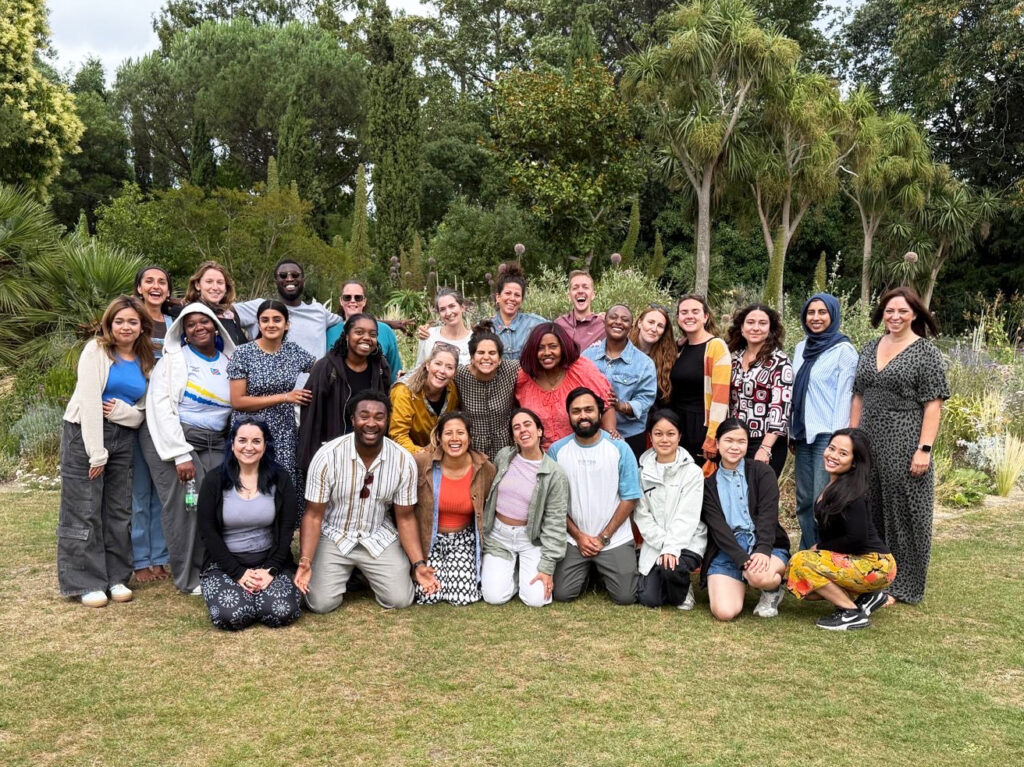 The SCN team, stood in a park in London, all smiling after a team picnic