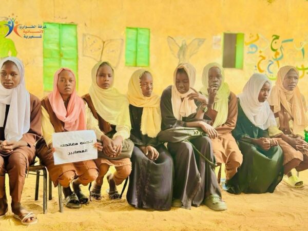 A group of women, sat at an ERR in Sudan